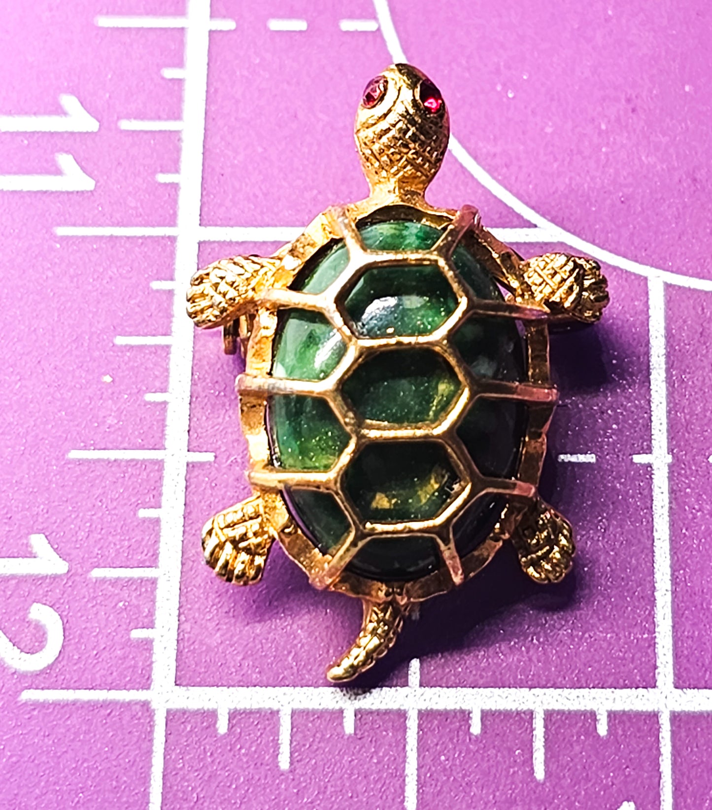 Turtle green lucite and gold toned vintage reptile brooch with red rhinestone eyes
