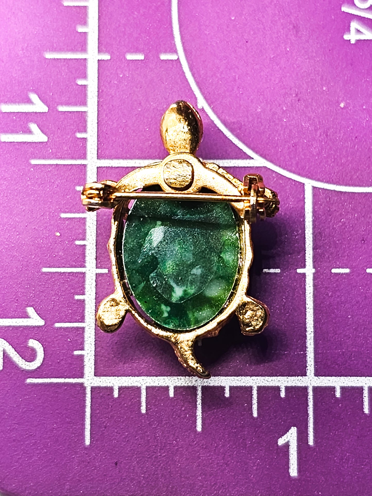 Turtle green lucite and gold toned vintage reptile brooch with red rhinestone eyes