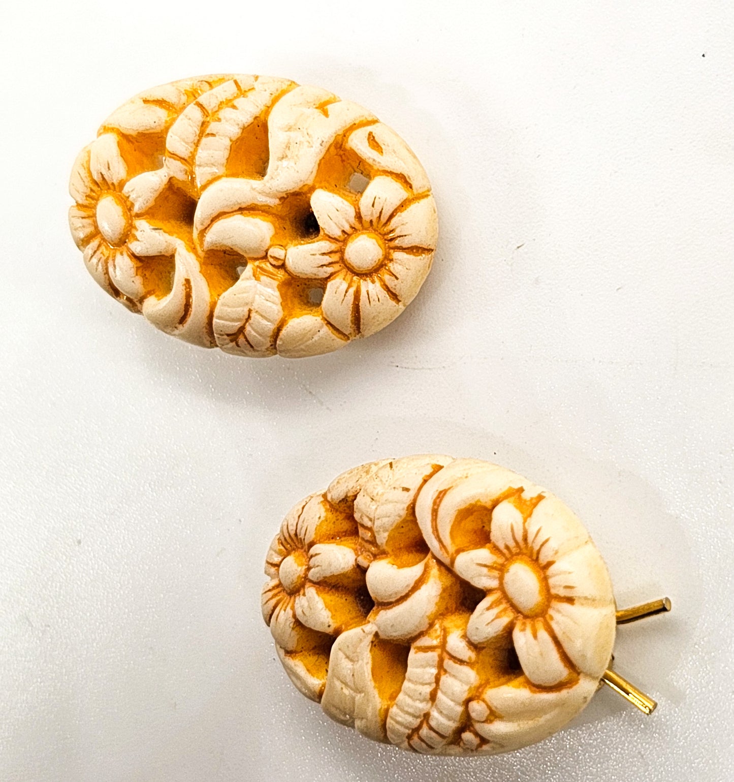 Molded pierced celluloid off-white flower pair of vintage barrettes mid century