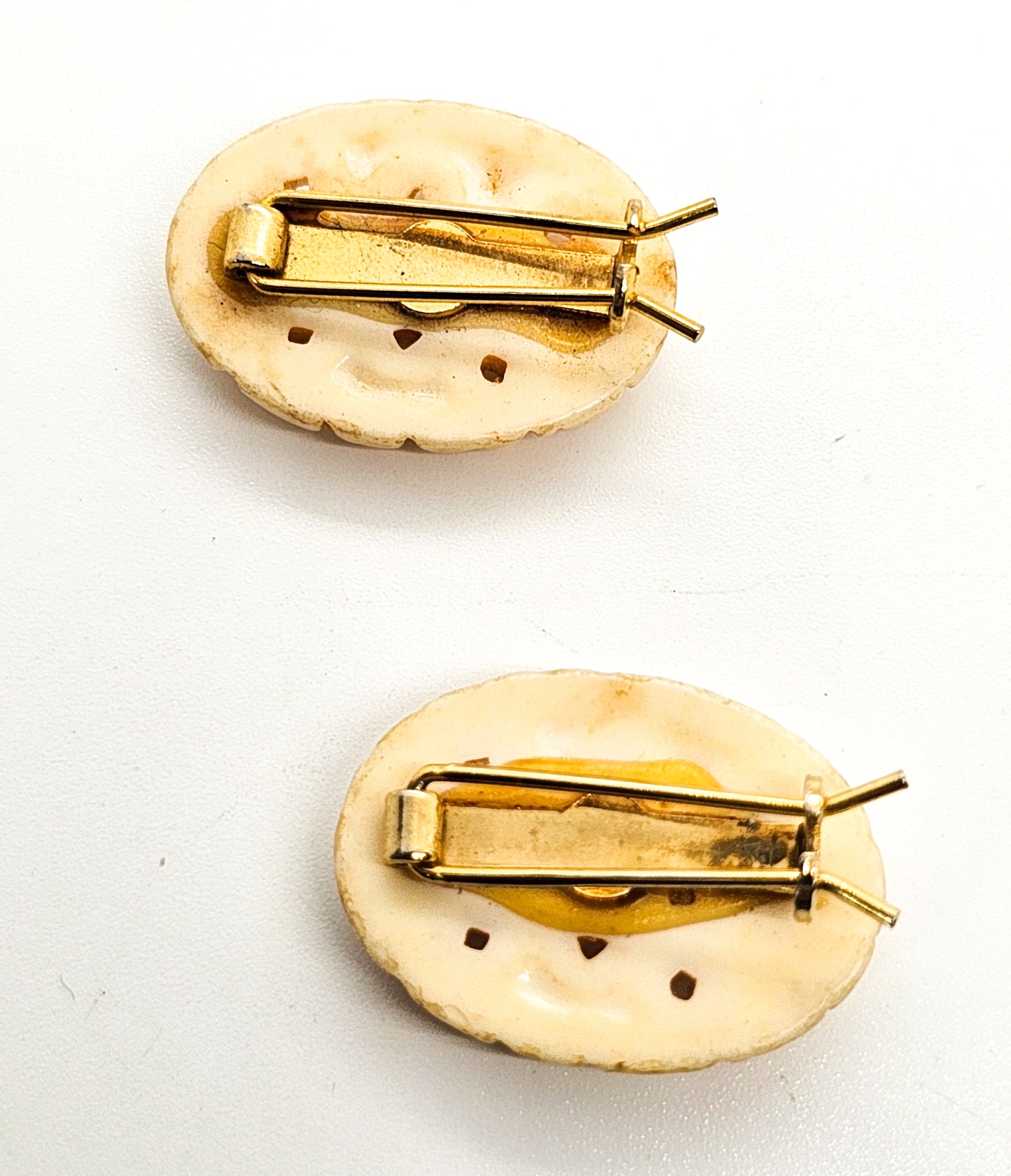 Molded pierced celluloid off-white flower pair of vintage barrettes mid century