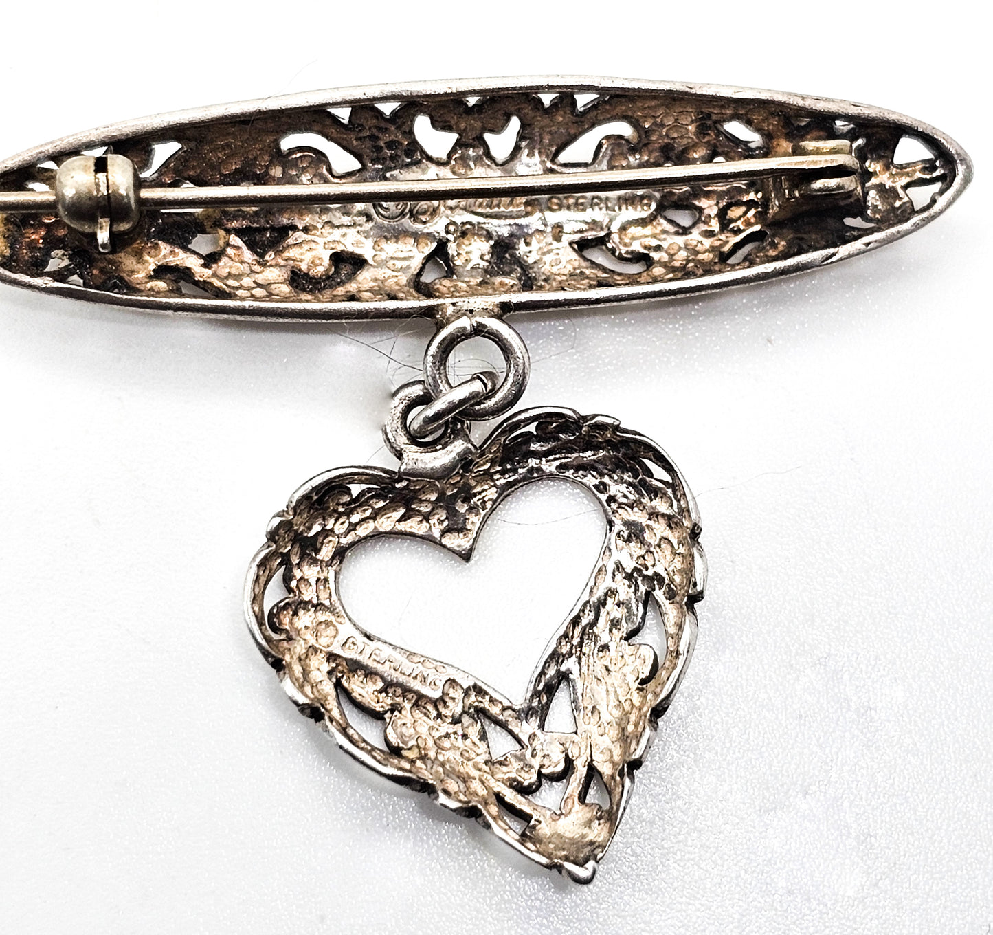Jezlaine open work filigree heart drop medal style vintage sterling silver brooch