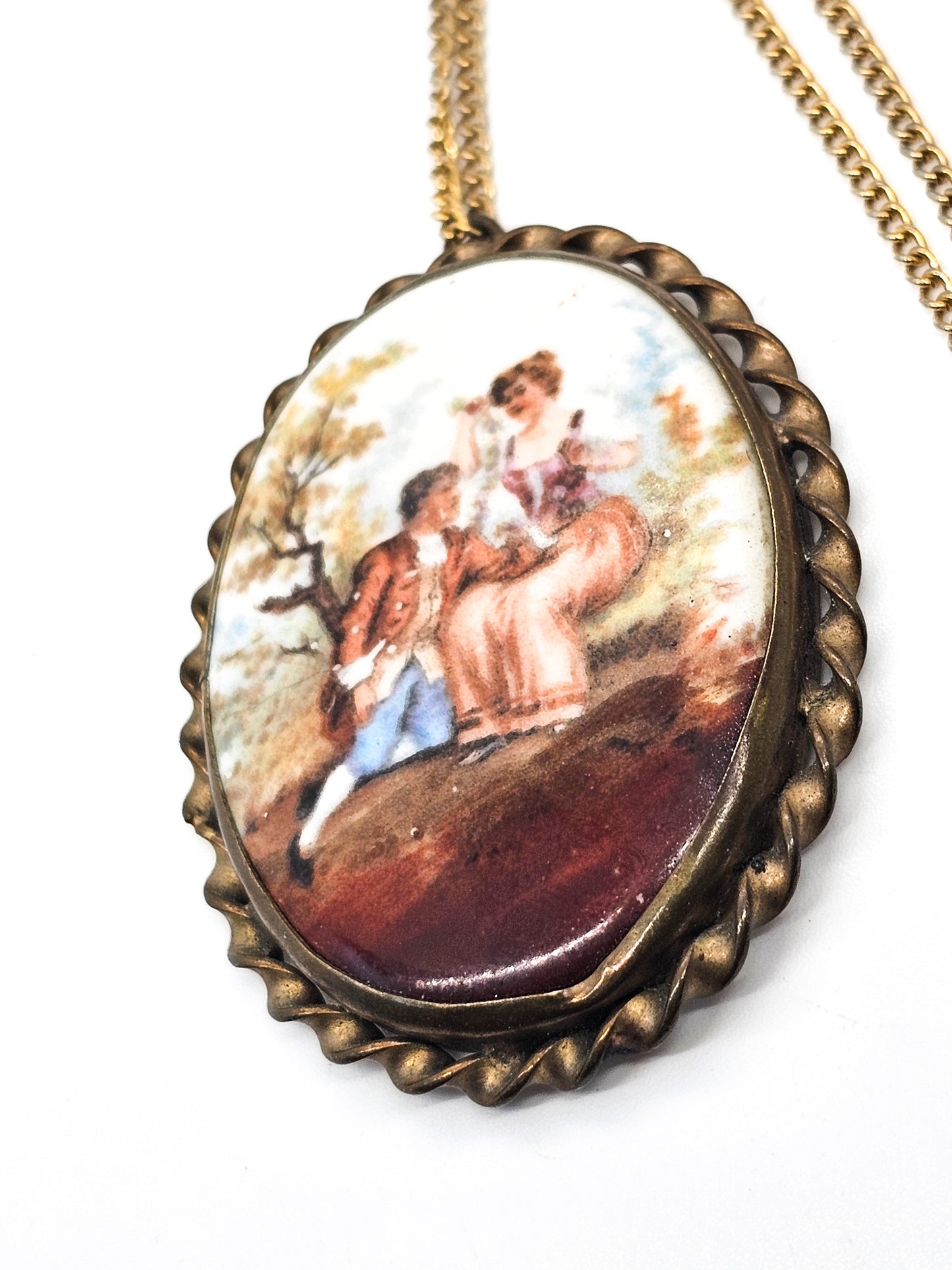 Painted Porcelain Courting Couple painted porcelain antique brass necklace