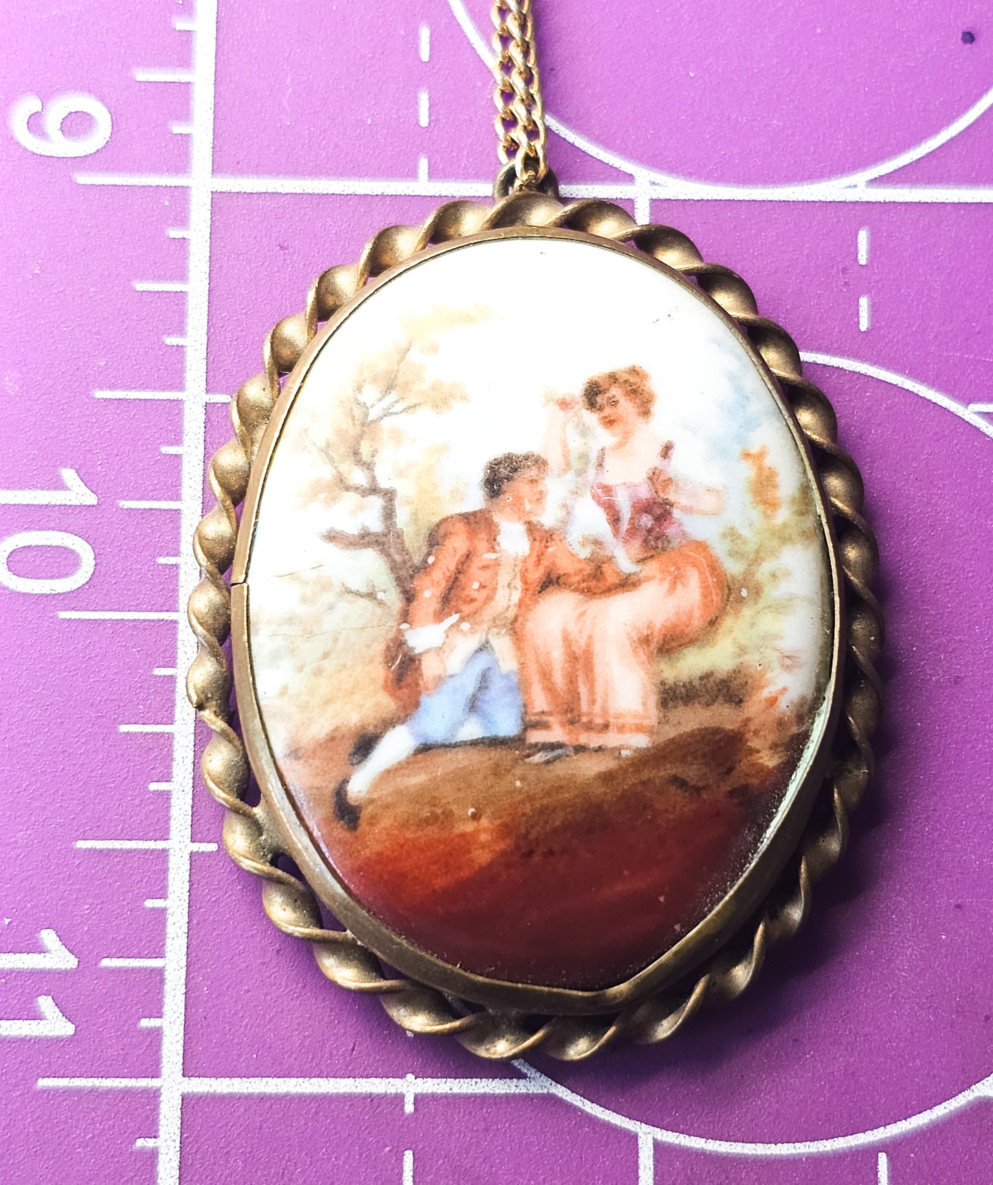 Painted Porcelain Courting Couple painted porcelain antique brass necklace