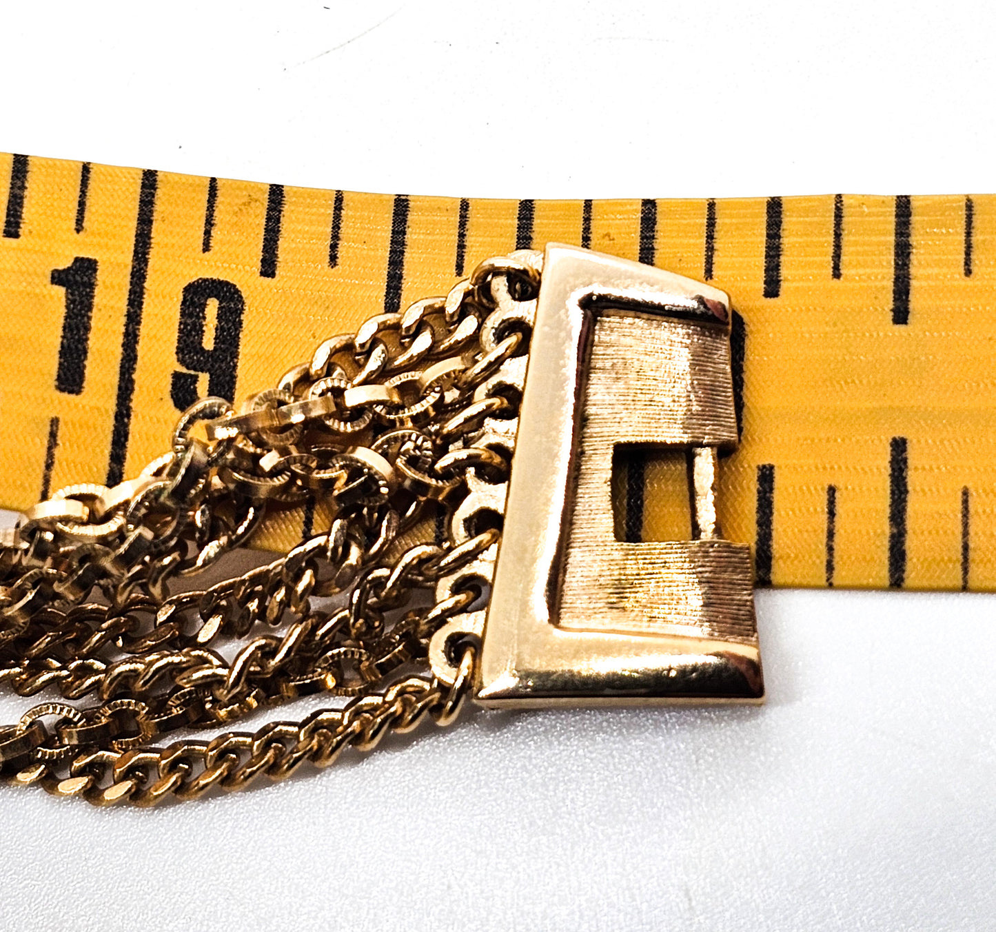 Crown Trifari gold toned 7 layer vintage chain necklace with fold over clasp