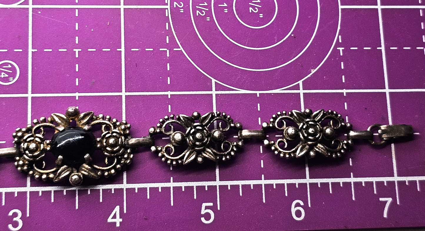 Filigree open work floral vintage panel bracelet with black stone accent