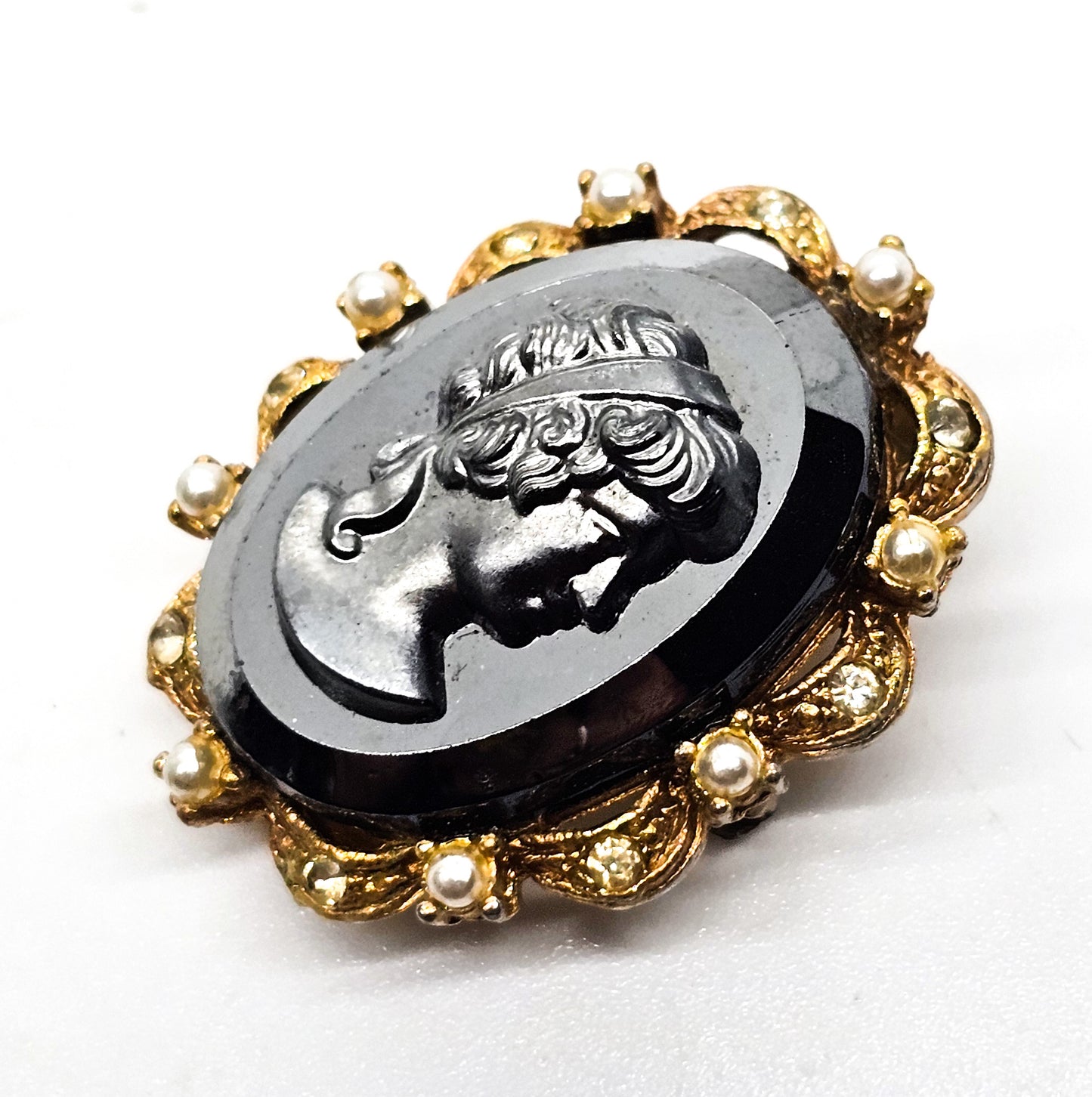 Carved Hematite cameo gold toned faux pearl and rhinestone vintage clasp brooch