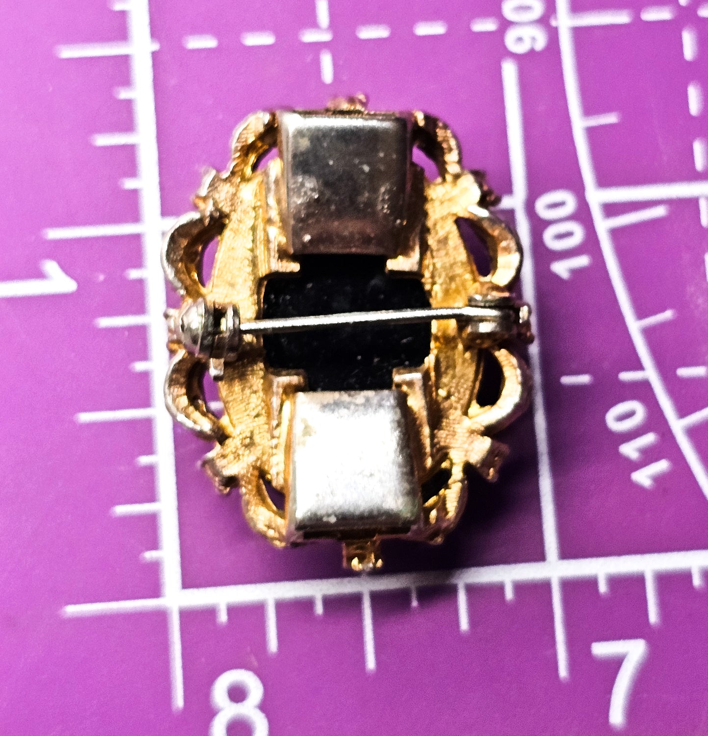 Carved Hematite cameo gold toned faux pearl and rhinestone vintage clasp brooch