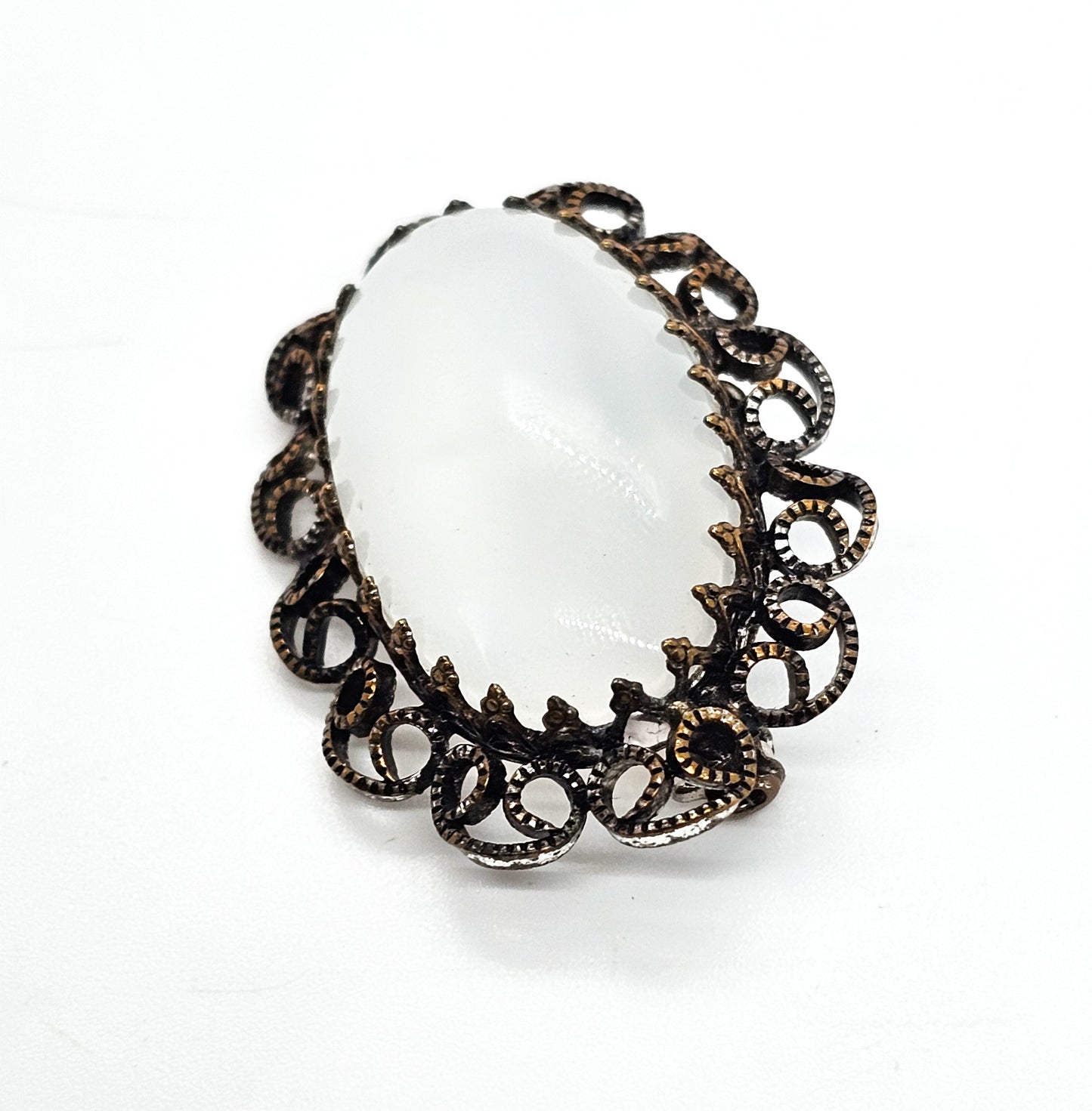 Austrian white Cat's Eye moonglow glass with filigree frame vintage brooch