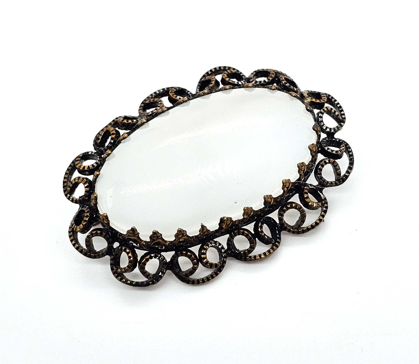 Austrian white Cat's Eye moonglow glass with filigree frame vintage brooch