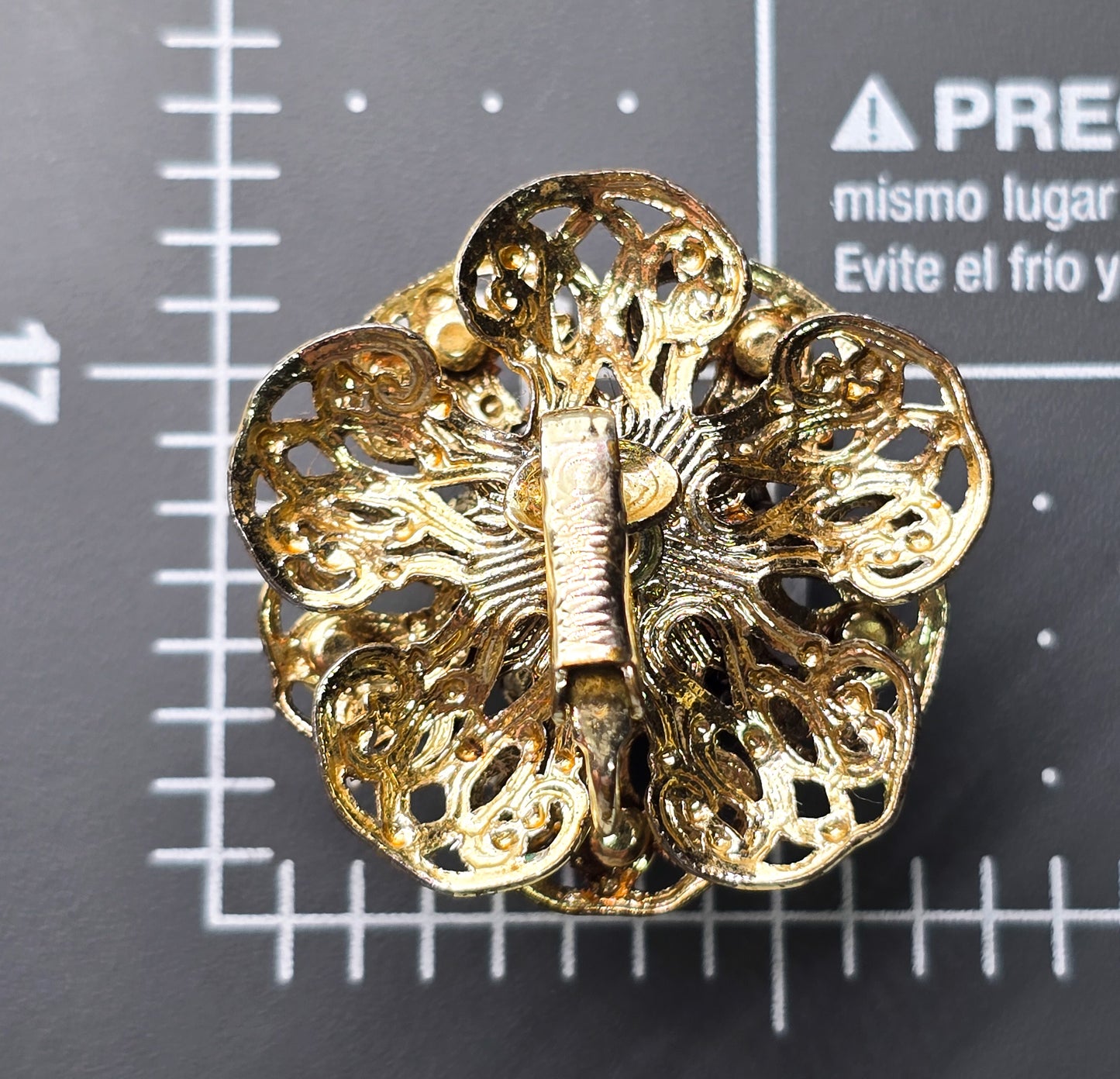 Sarah Coventry red Aurora Borealis rainbow gold toned filigree flower clip on earrings