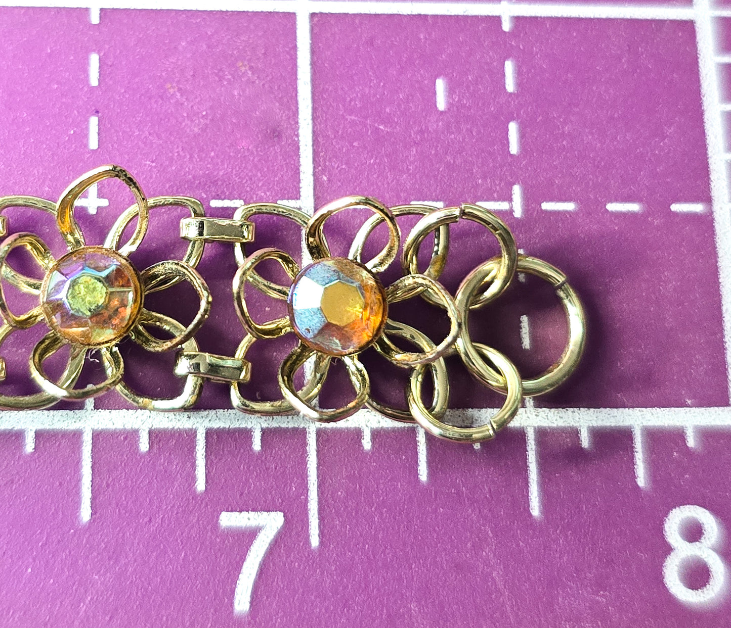 Aurora Borealis rainbow rhinestone flower gold toned bracelet mid century