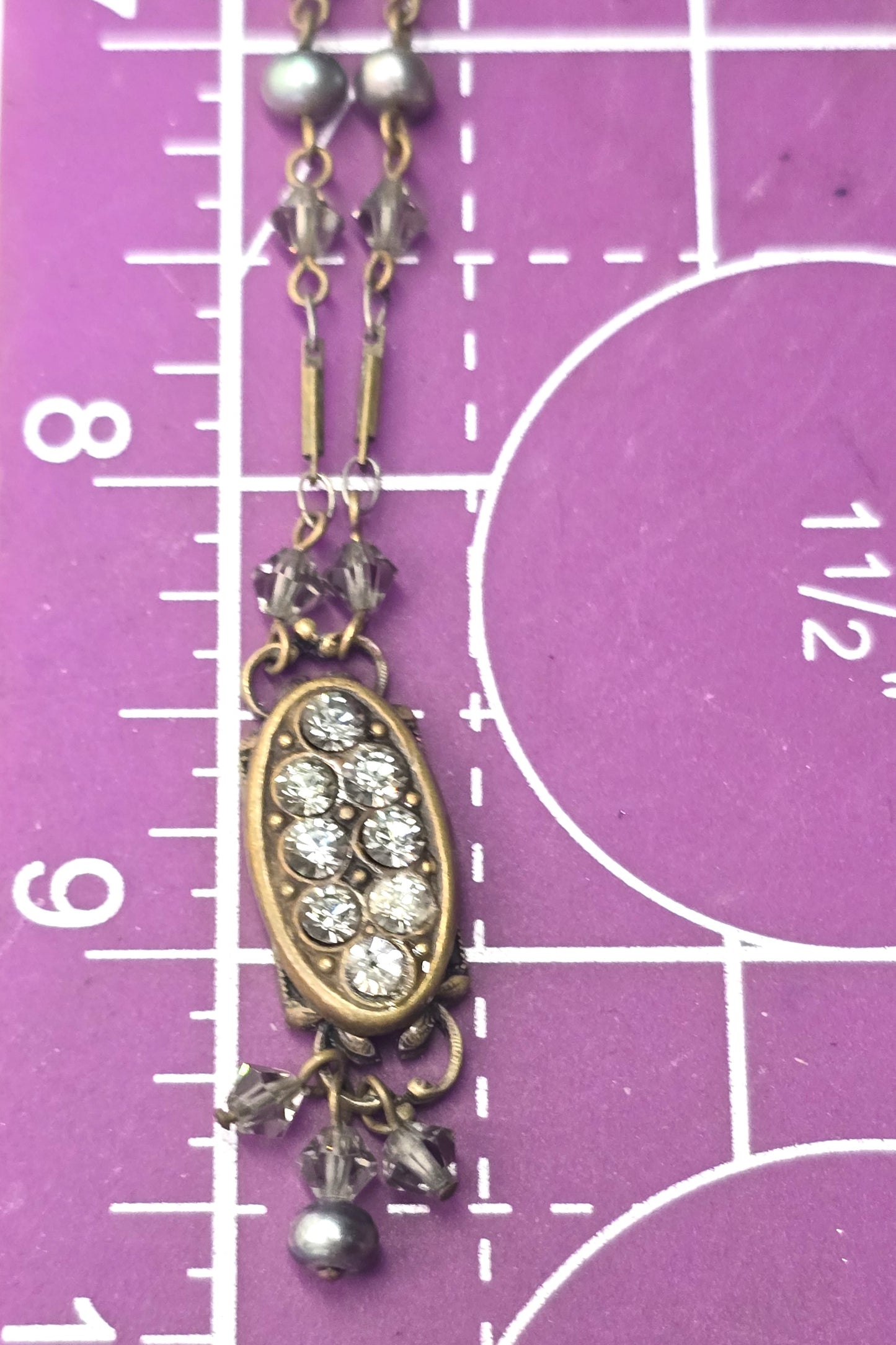 Liz Palacios necklace oval bronze pendant adorned with rhinestone accents