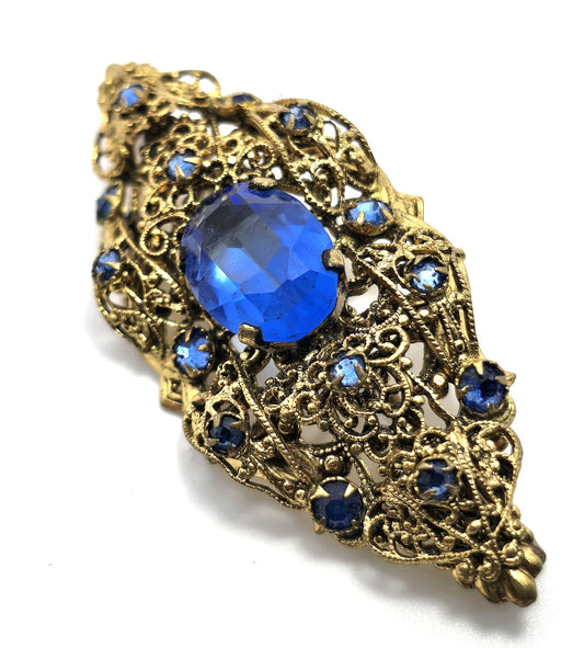 Czech bright blue paste glass rhinestone vintage gold toned filigree brooch