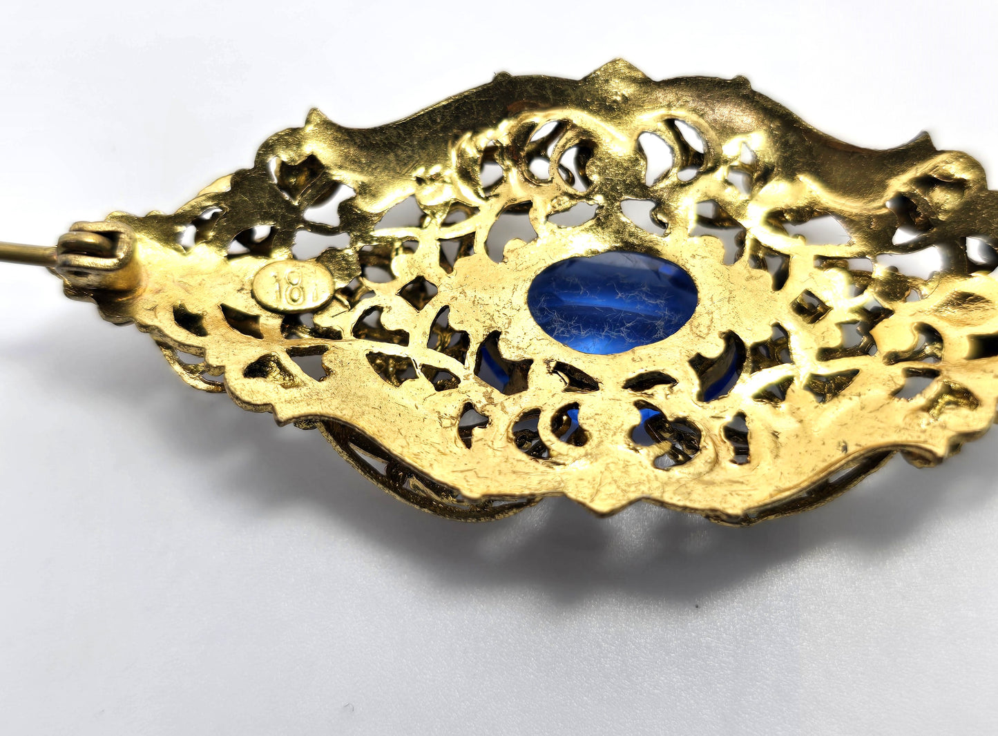 Czech bright blue paste glass rhinestone vintage gold toned filigree brooch