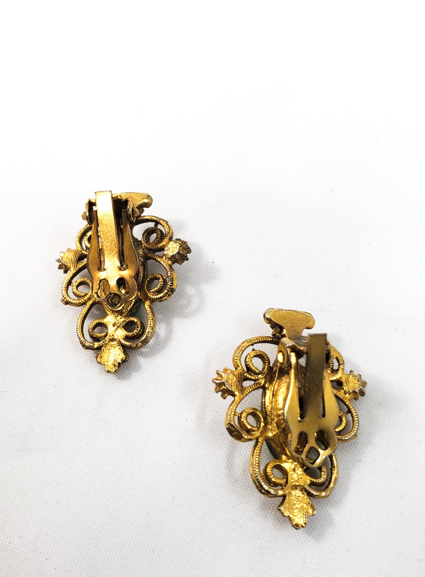 Vintage gold Christmas tree clip on earrings with molded green aurora borealis rhinestone