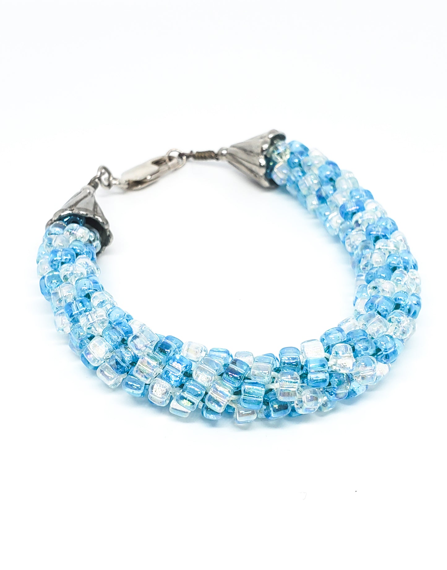 Oceans baby blue and clear torsade beaded bracelet with sterling silver clasp