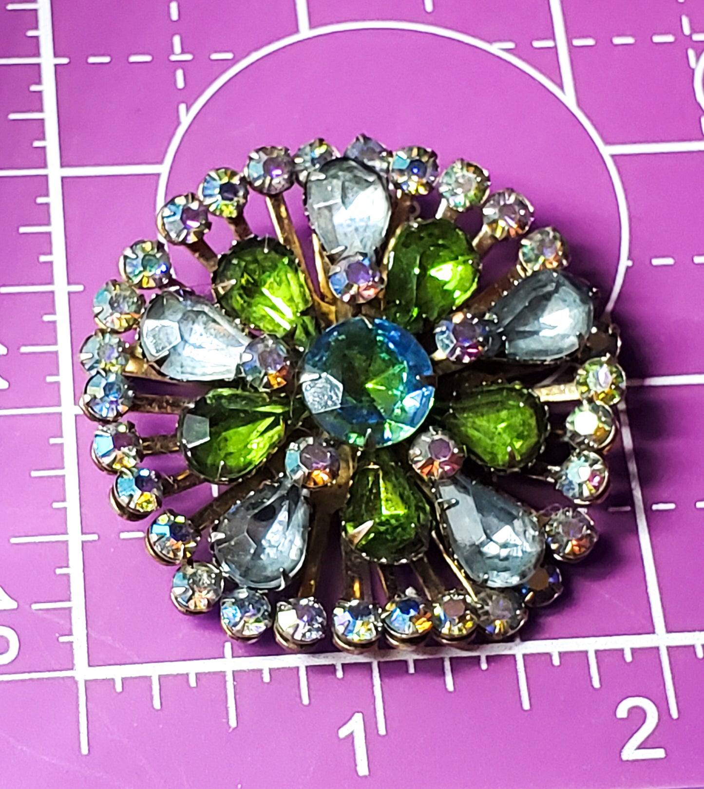 baby blue and green aurora borealis heliotrope rhinestone atomic brooch mid century