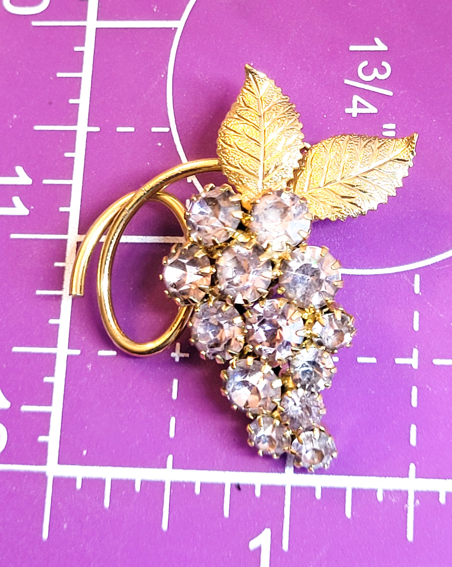 Purple rhinestone gold toned vintage grape cluster brooch