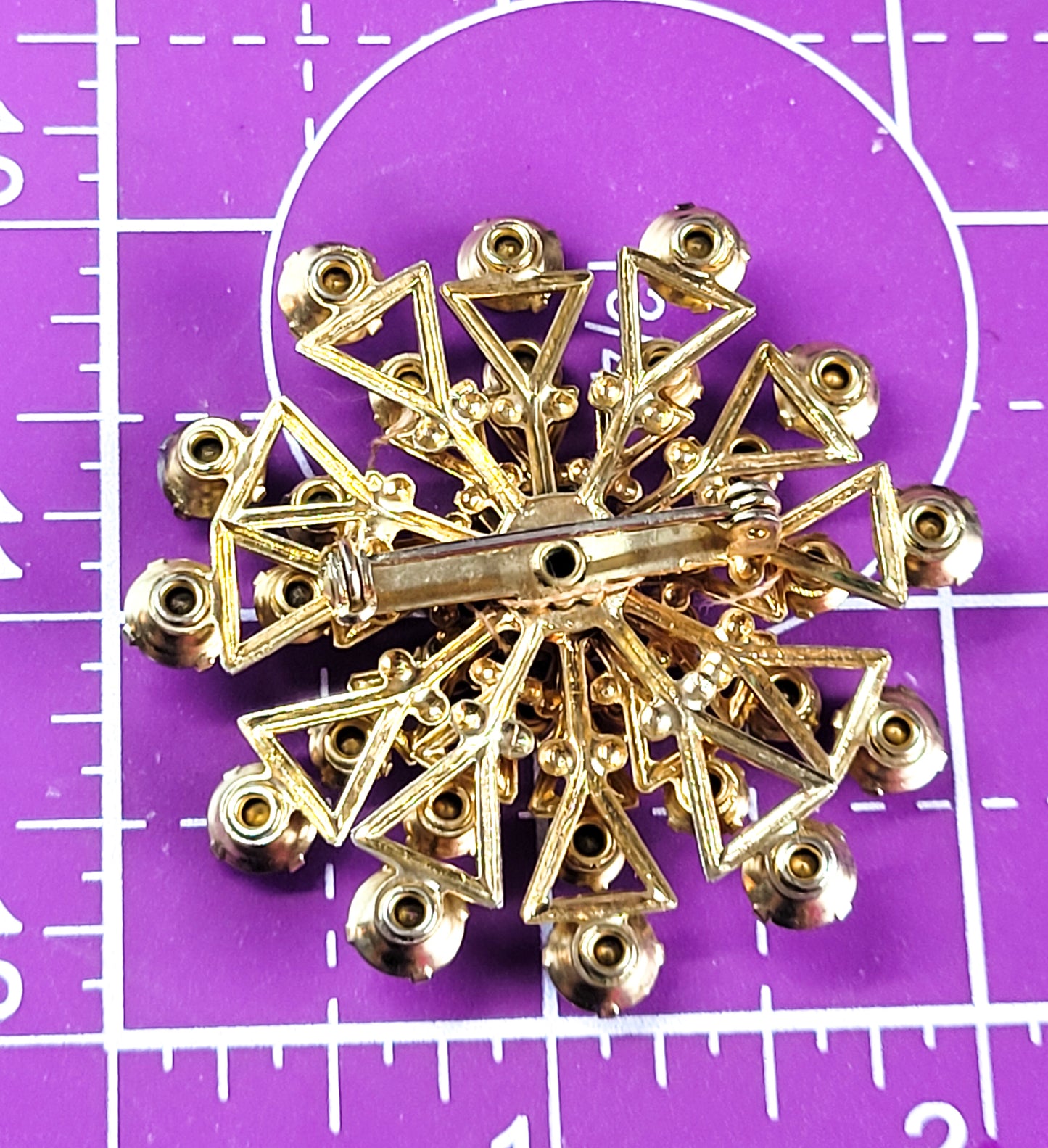 Carnival multi colored rhinestone mid century atomic brooch