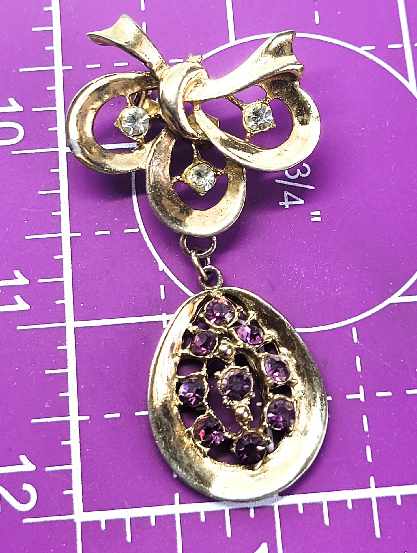 Mid Century Purple and gold vintage drop bow articulated rhinestone brooch