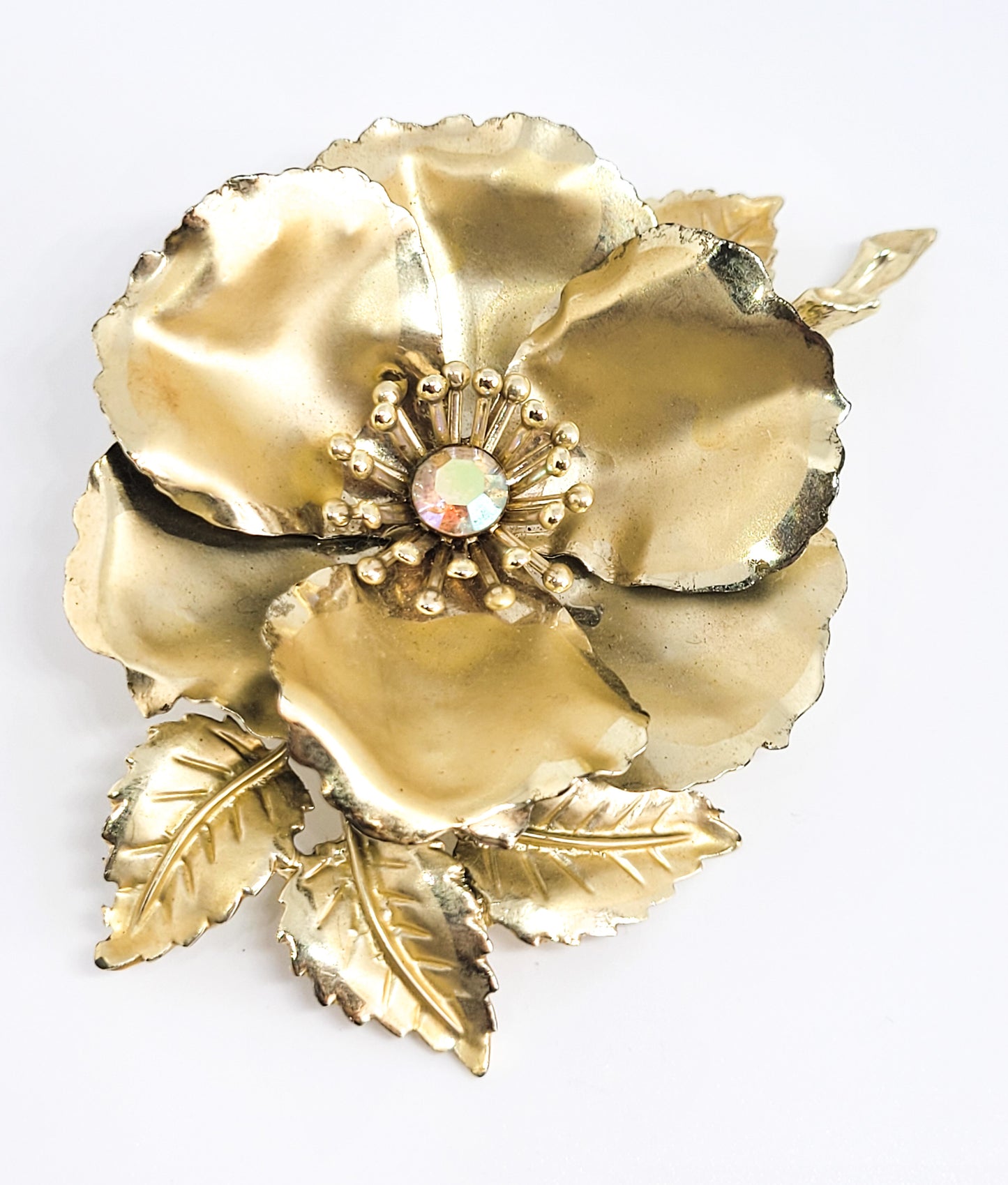 Coro signed Aurora borealis gold toned detailed signed flower brooch