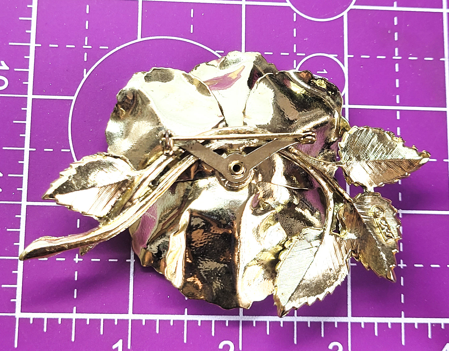 Coro signed Aurora borealis gold toned detailed signed flower brooch
