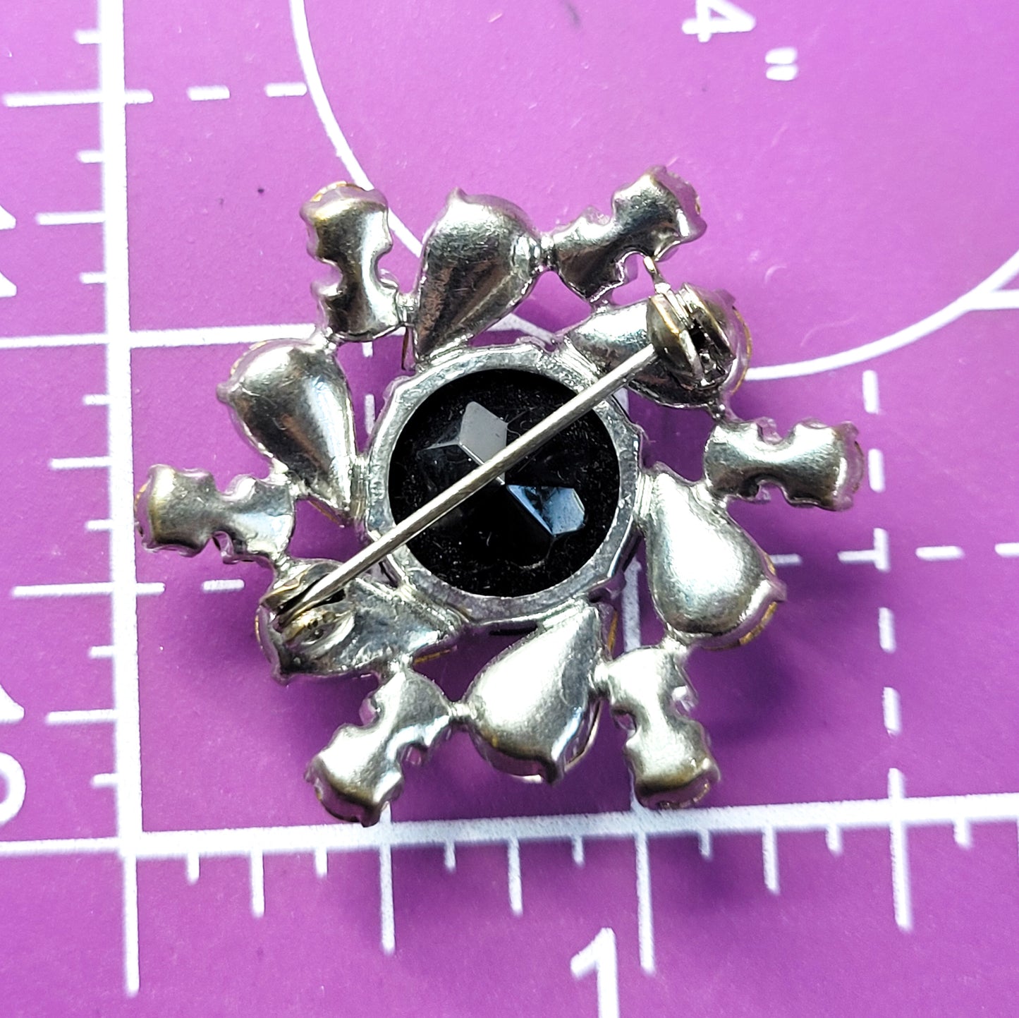 Atomic spiral Hematite glass and clear rhinestone vintage brooch mid century