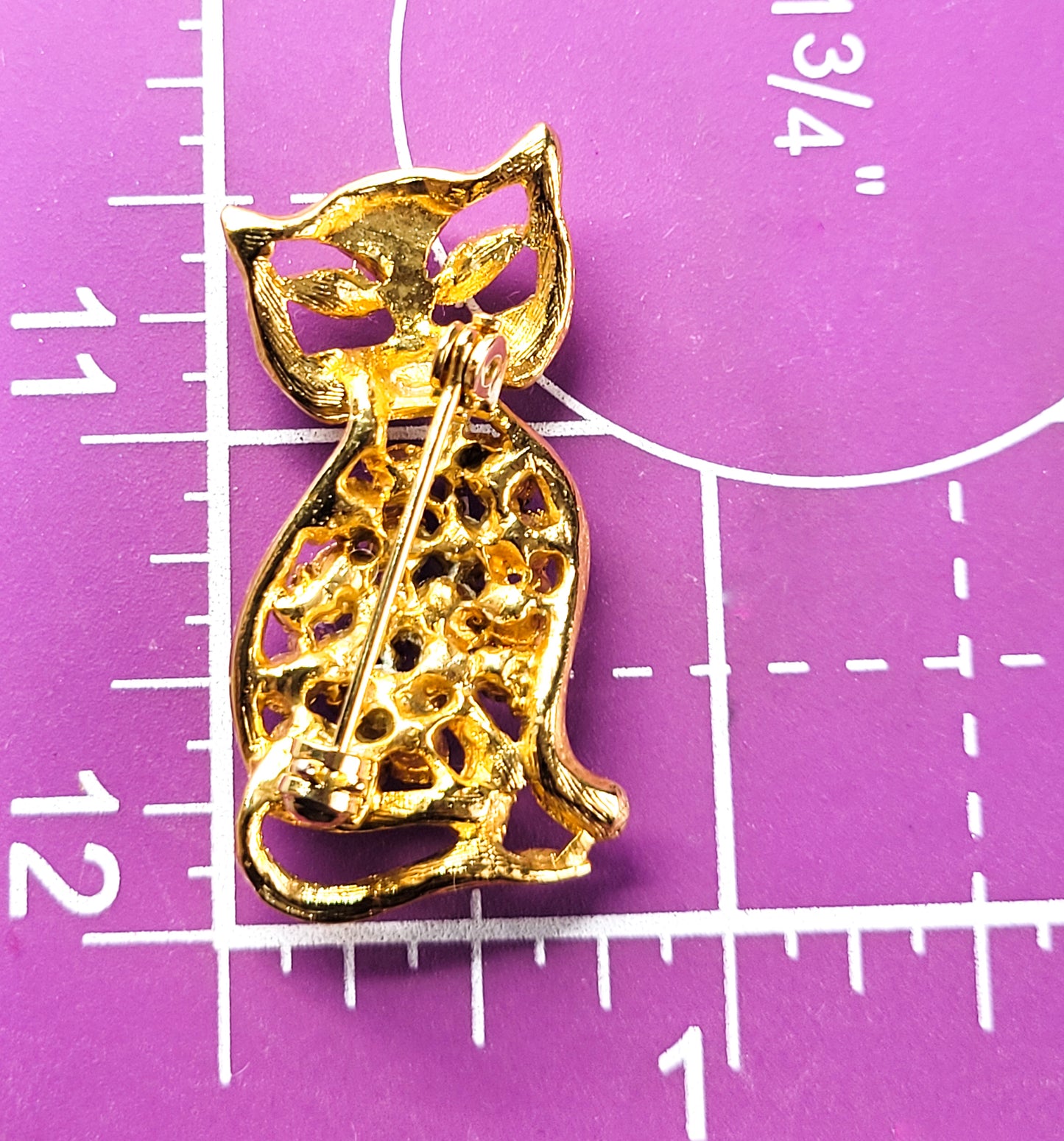 Pink rhinestone gold toned open work vintage figural kitty cat brooch