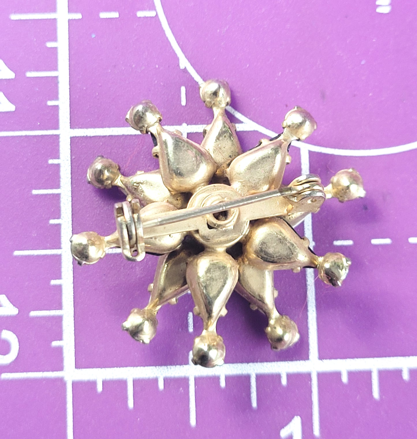 Black and white harlequin star vintage gold toned rhinestone brooch