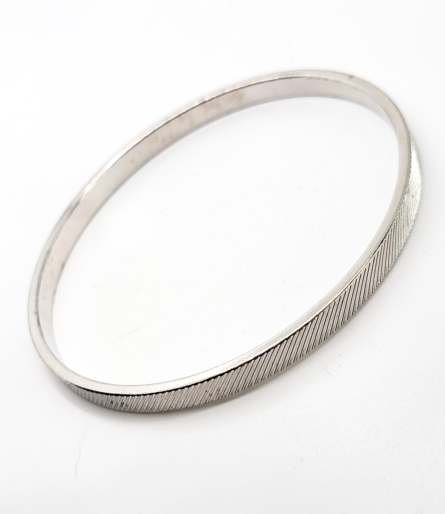Monet silver toned etched line thin textured vintage bangle bracelet