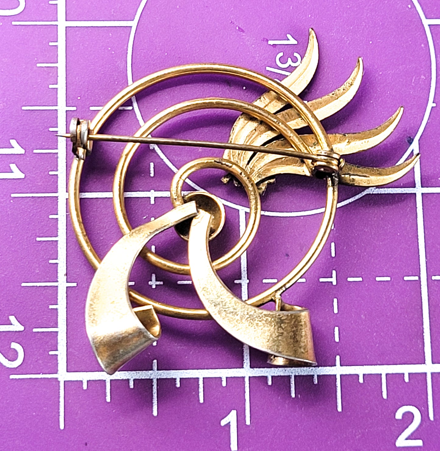 Modernist gold toned atomic spiral 2 tone vintage brooch