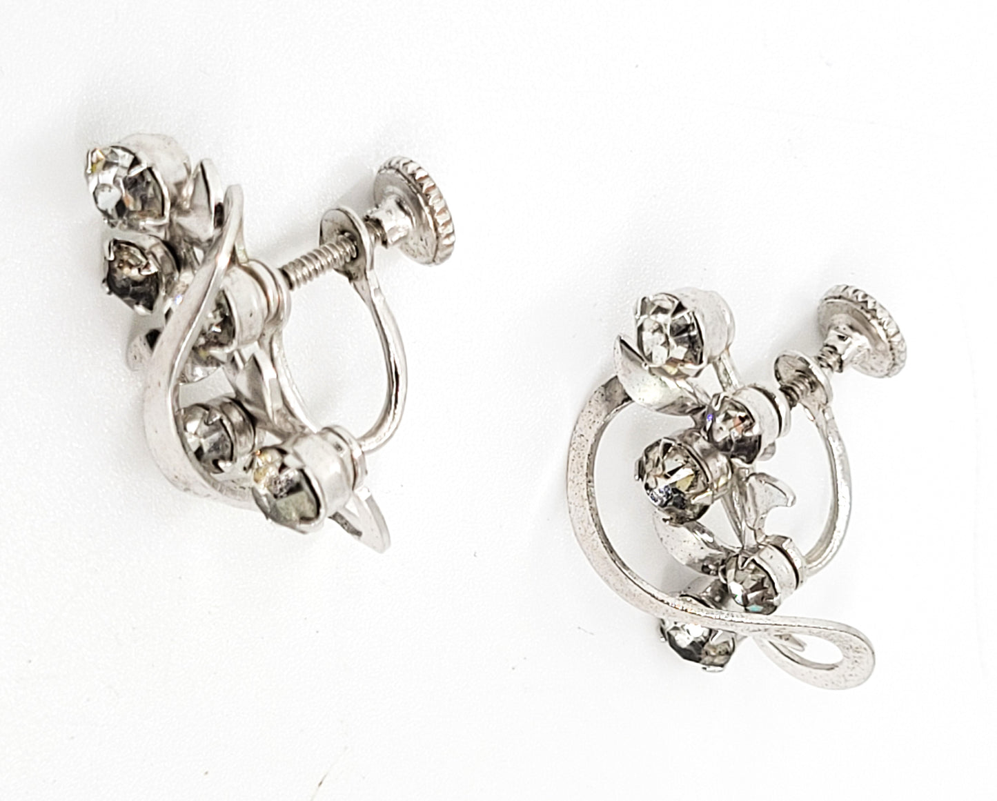 Clear rhinestone atomic swirl vintage clear mid century silver screw back earrings