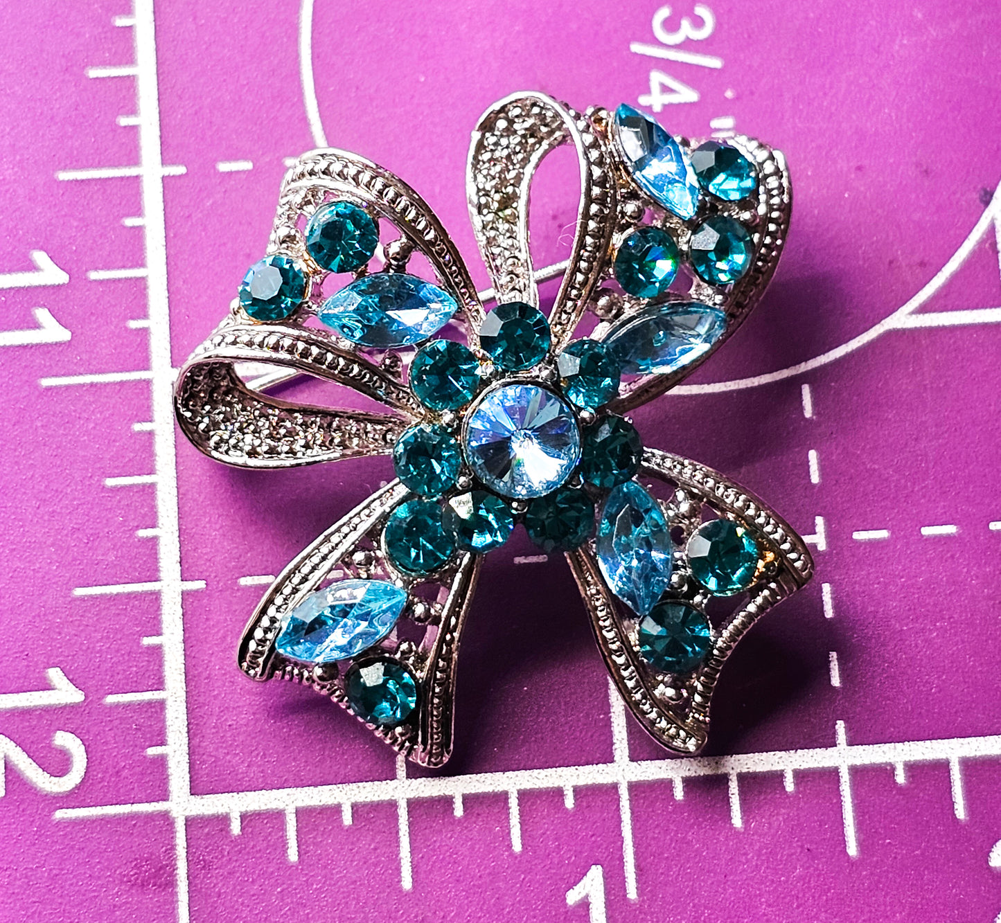Teal and Aqua blue rhinestone silver toned vintage flower bow brooch
