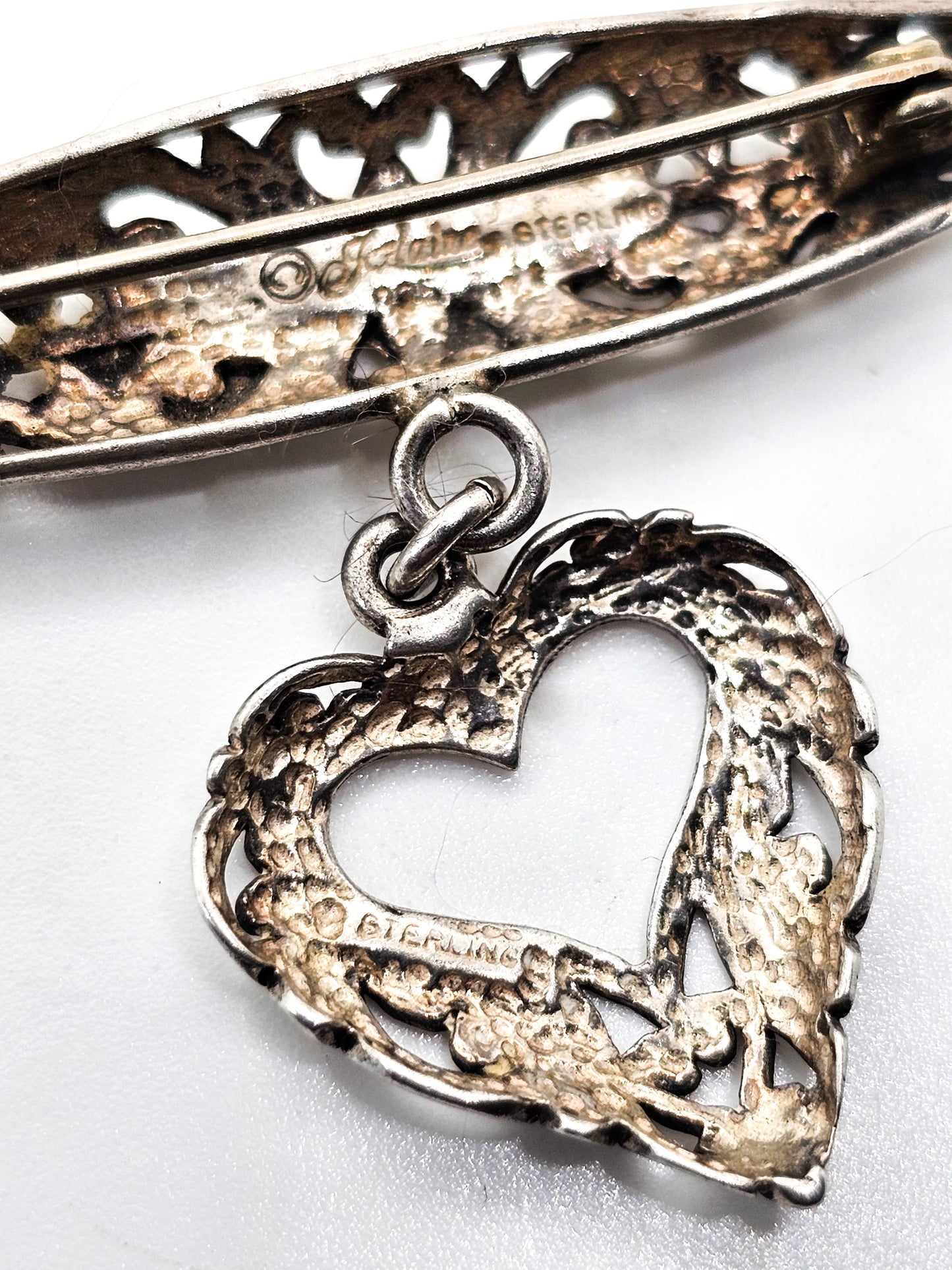 Jezlaine open work filigree heart drop medal style vintage sterling silver brooch