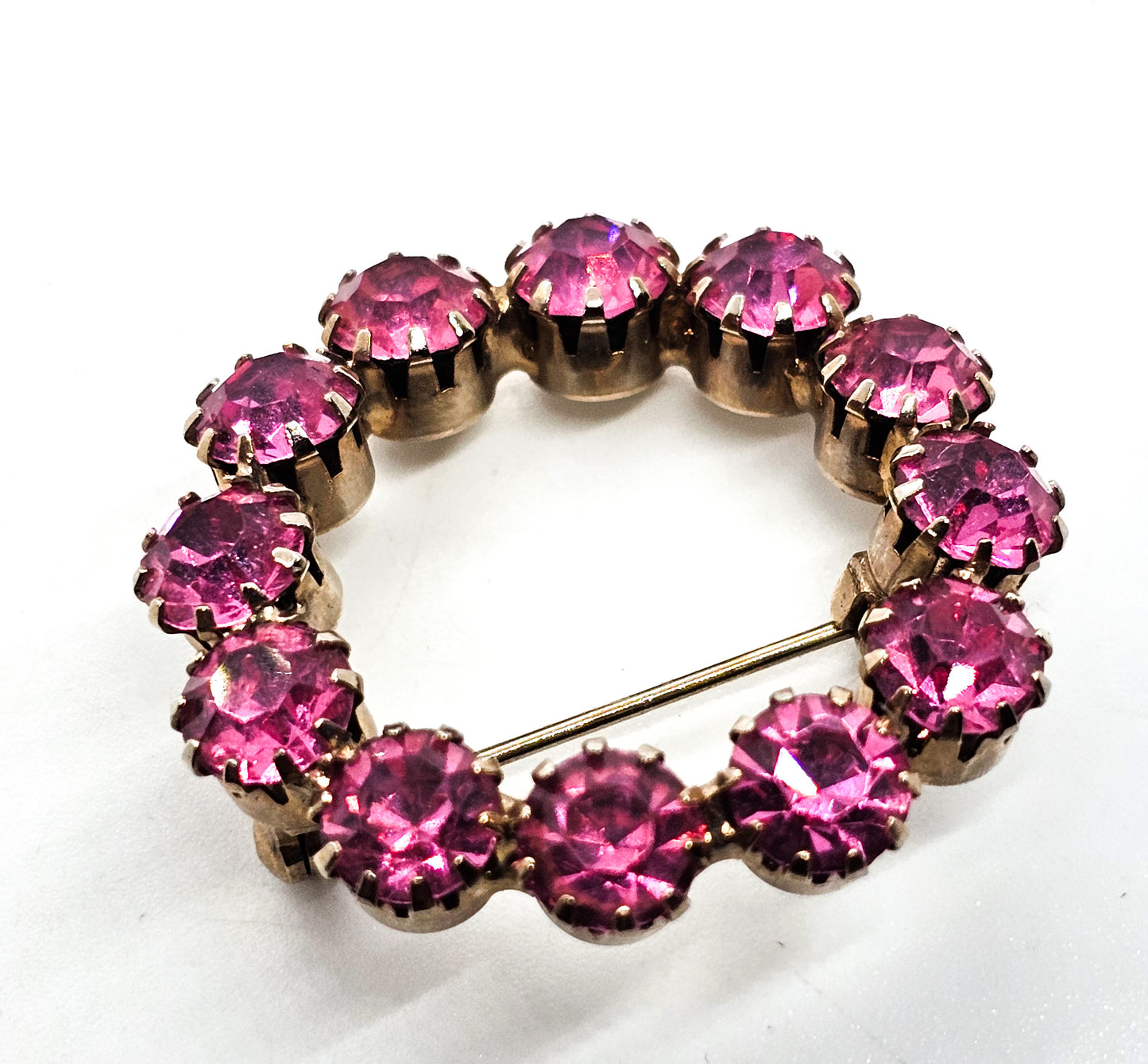 Bright Pink prong set gold toned vintage mid century rhinestone circle brooch