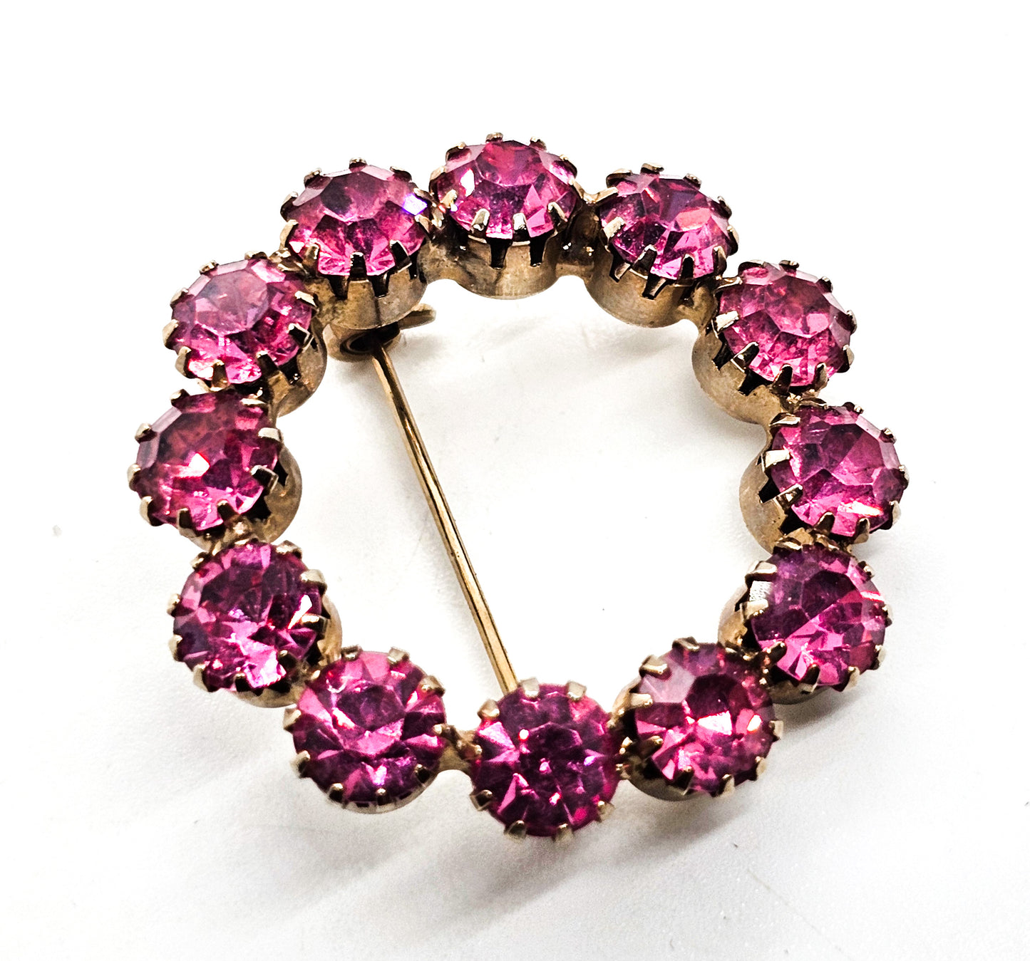 Bright Pink prong set gold toned vintage mid century rhinestone circle brooch