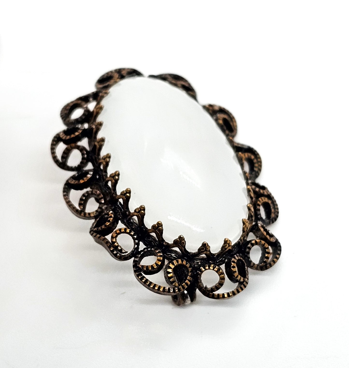 Austrian white Cat's Eye moonglow glass with filigree frame vintage brooch