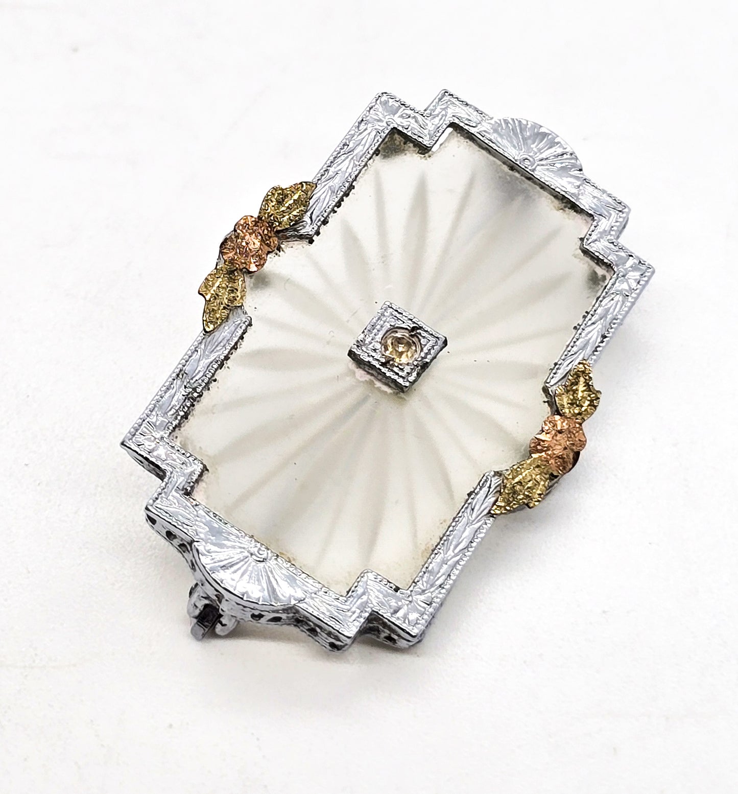 Rhodium plated camphor glass rhinestone brooch with gold overlay flower accents