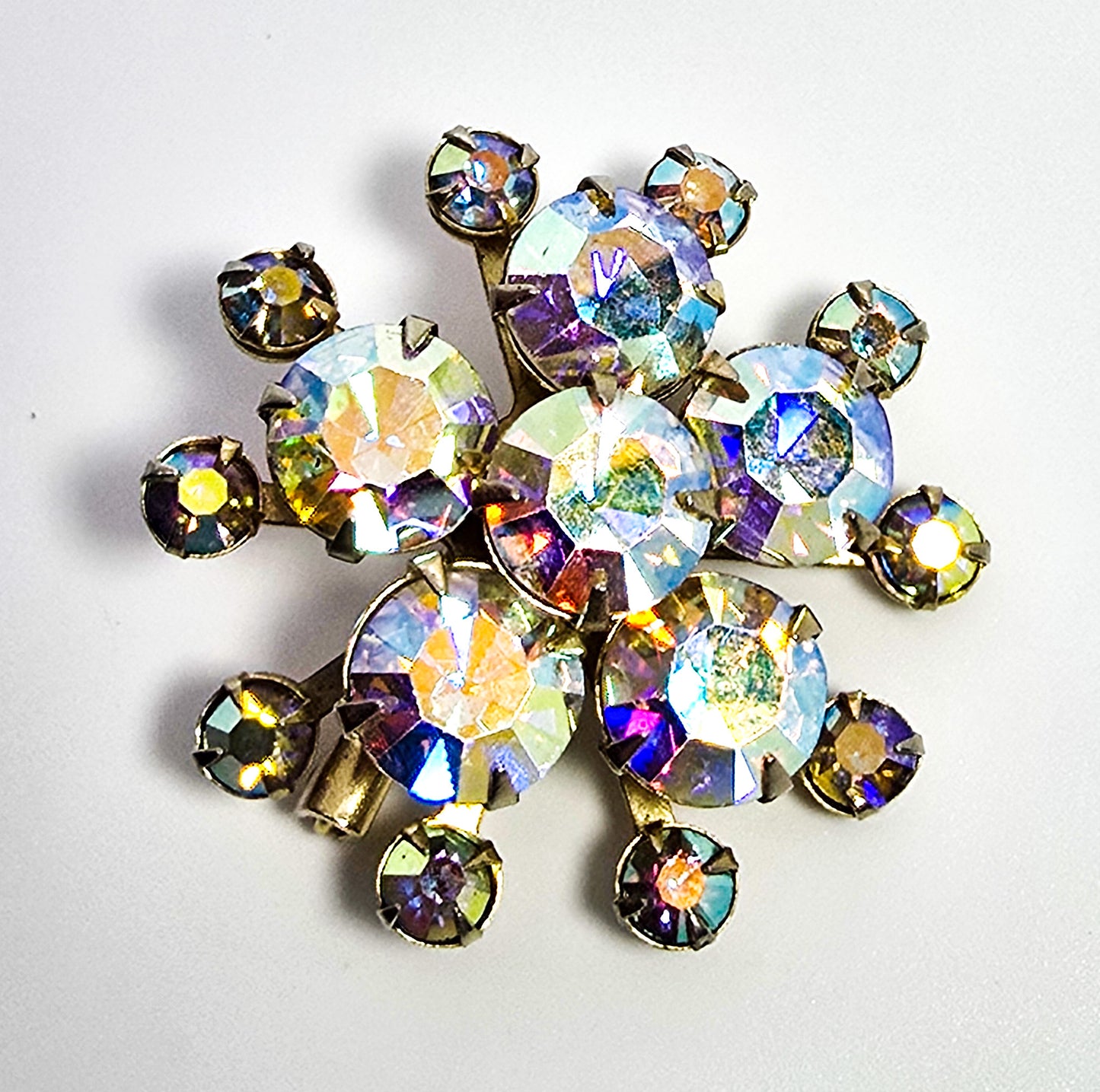 Aurora Borealis rhinestone golden star bust vintage mid century brooch