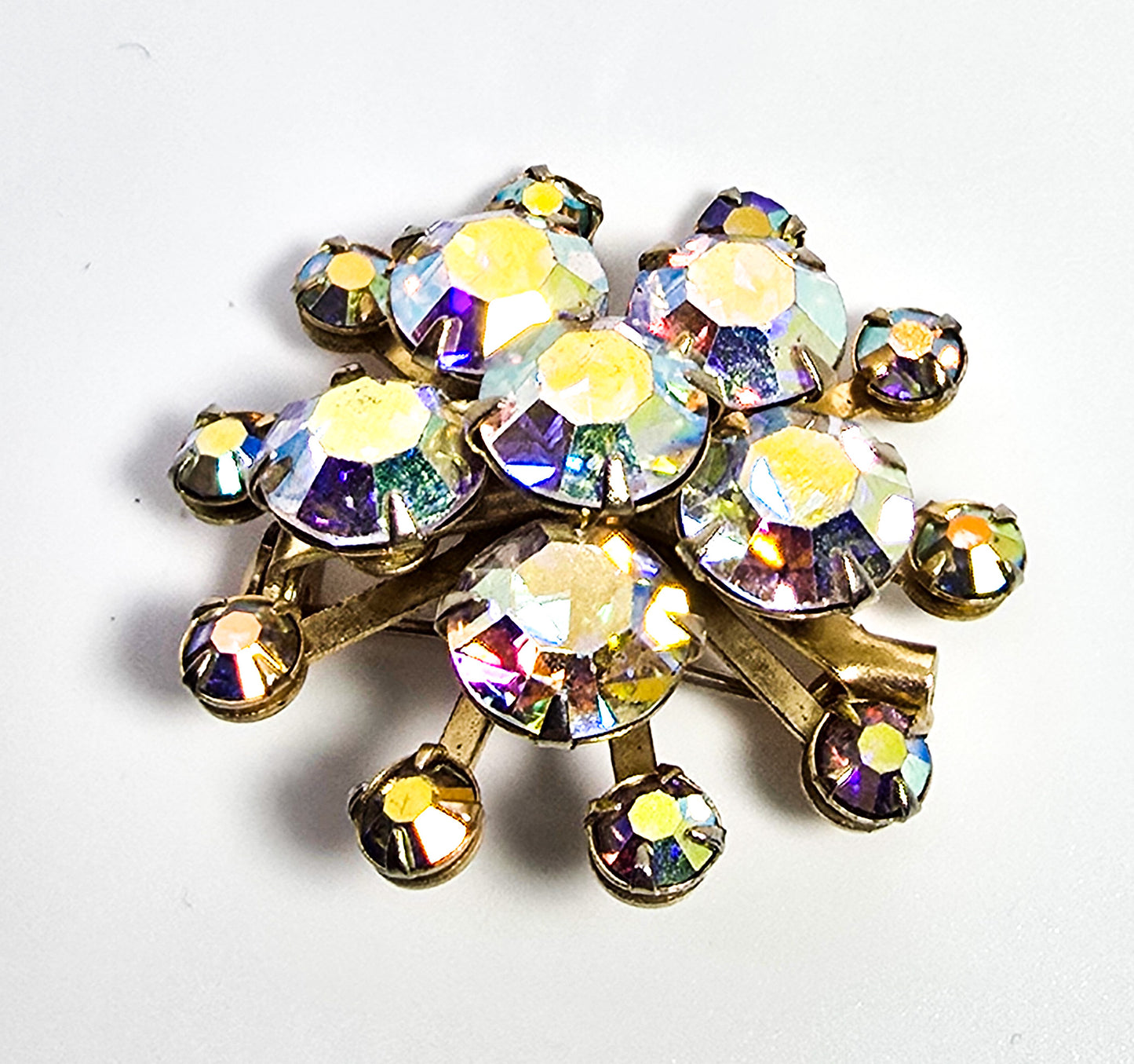 Aurora Borealis rhinestone golden star bust vintage mid century brooch