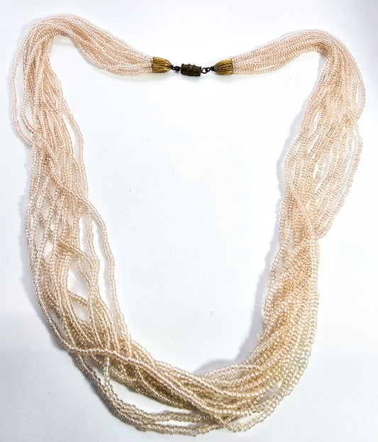 Multistrand Aurora Borealis cream seed bead 11 strand torsade necklace