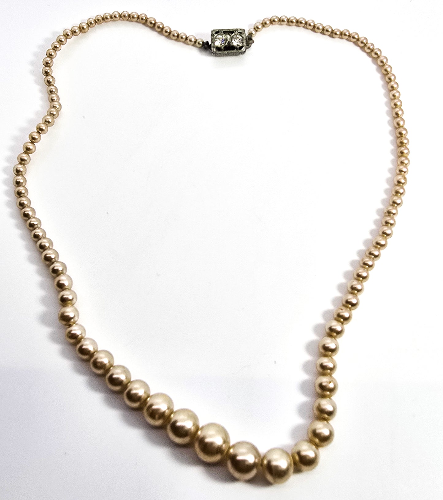 Graduated faux cream pearl single strand beaded rhinestone mid century Japan necklace