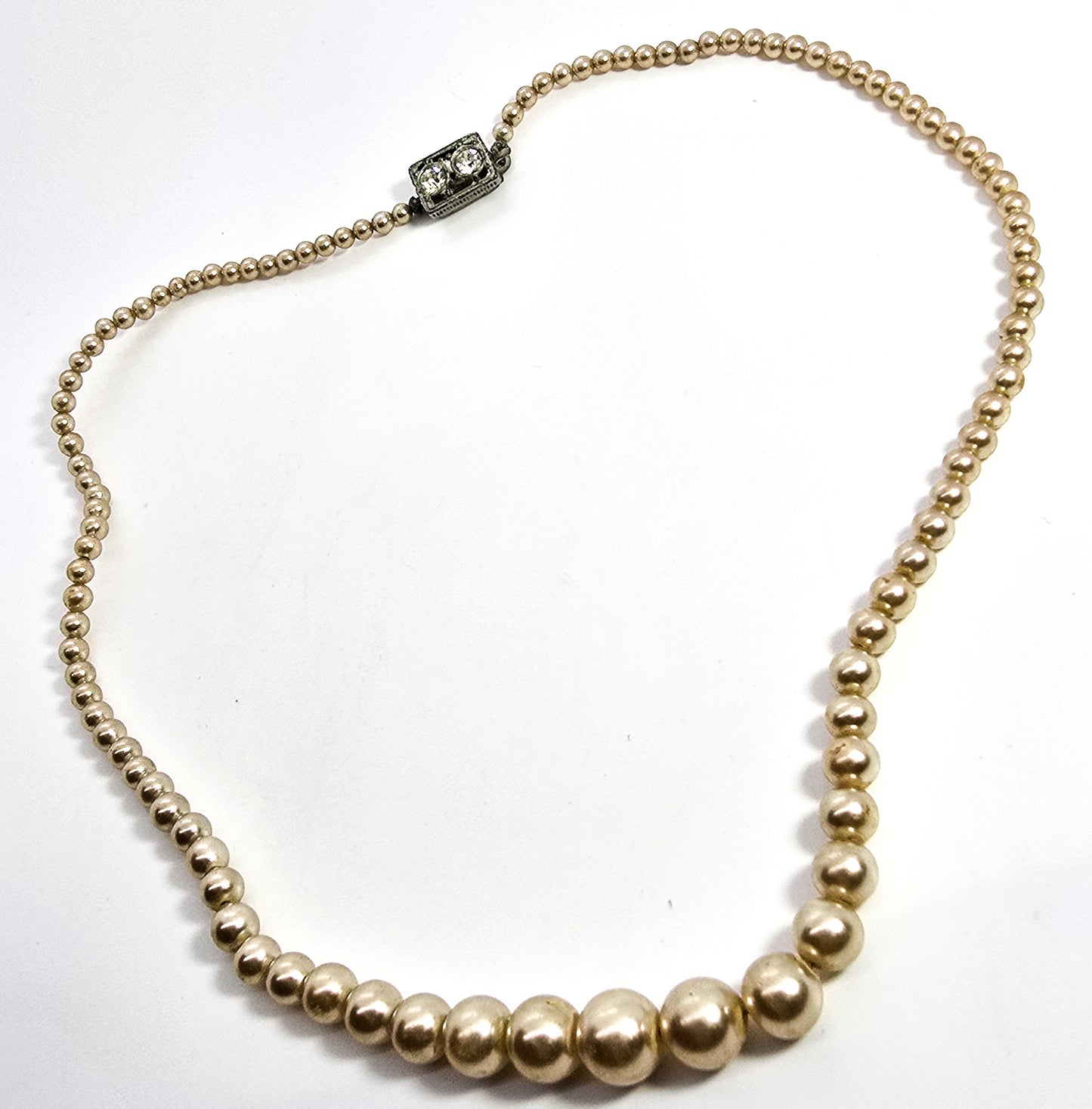 Graduated faux cream pearl single strand beaded rhinestone mid century Japan necklace