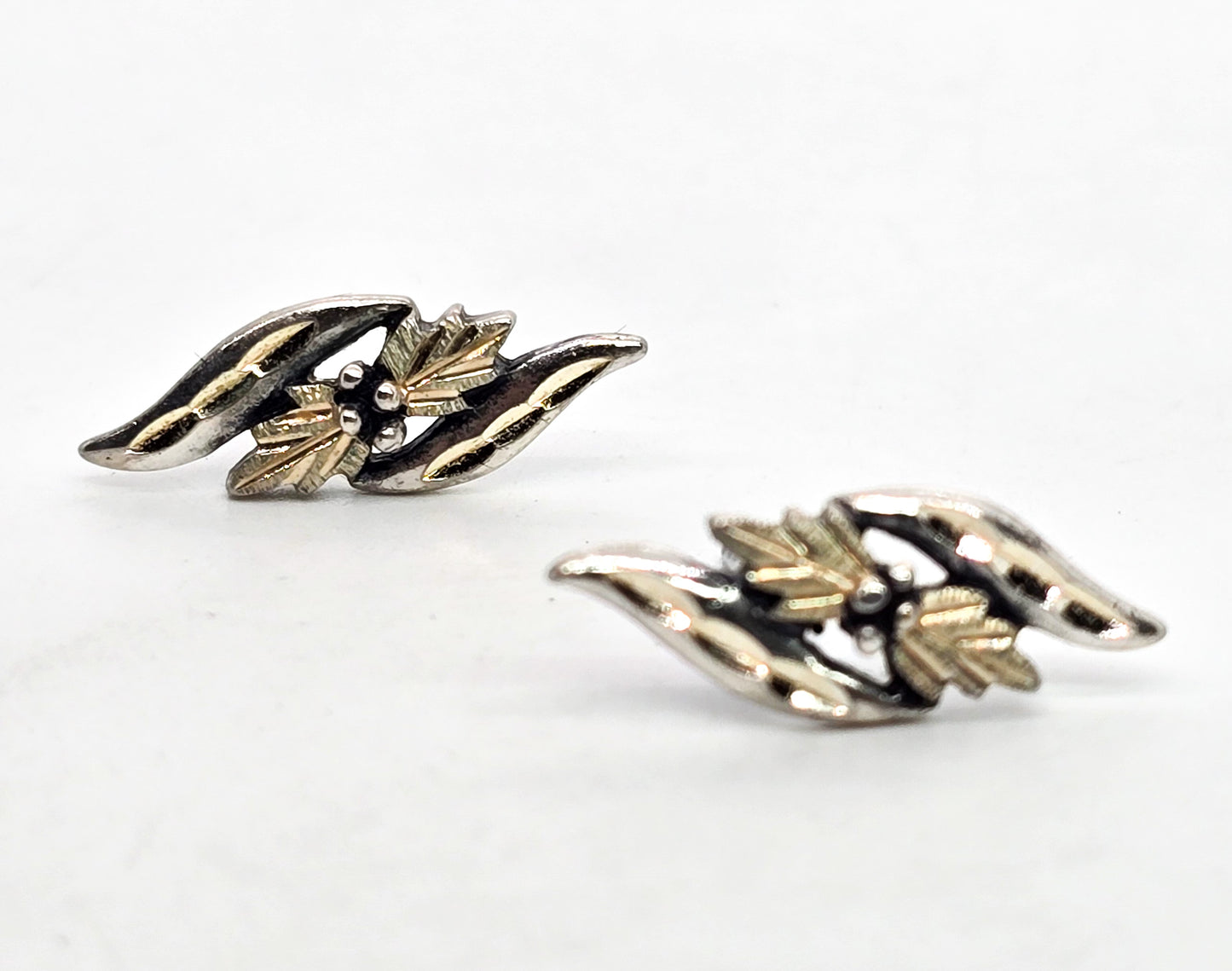 Wheeler Manufacturing Black Hills gold sterling silver double leaf stud earrings