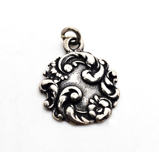 Antique Art Nouveau repousse sterling silver cartouche flower charm pendant