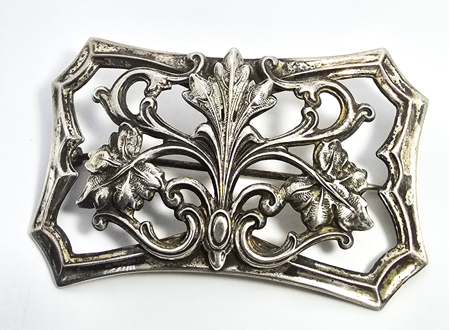 Art Nouveau cartouche repousse sterling silver front antique brooch