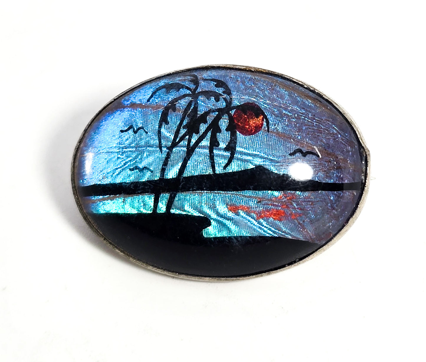 Butterfly wing palm tree beach hand painted vintage silver toned oval brooch