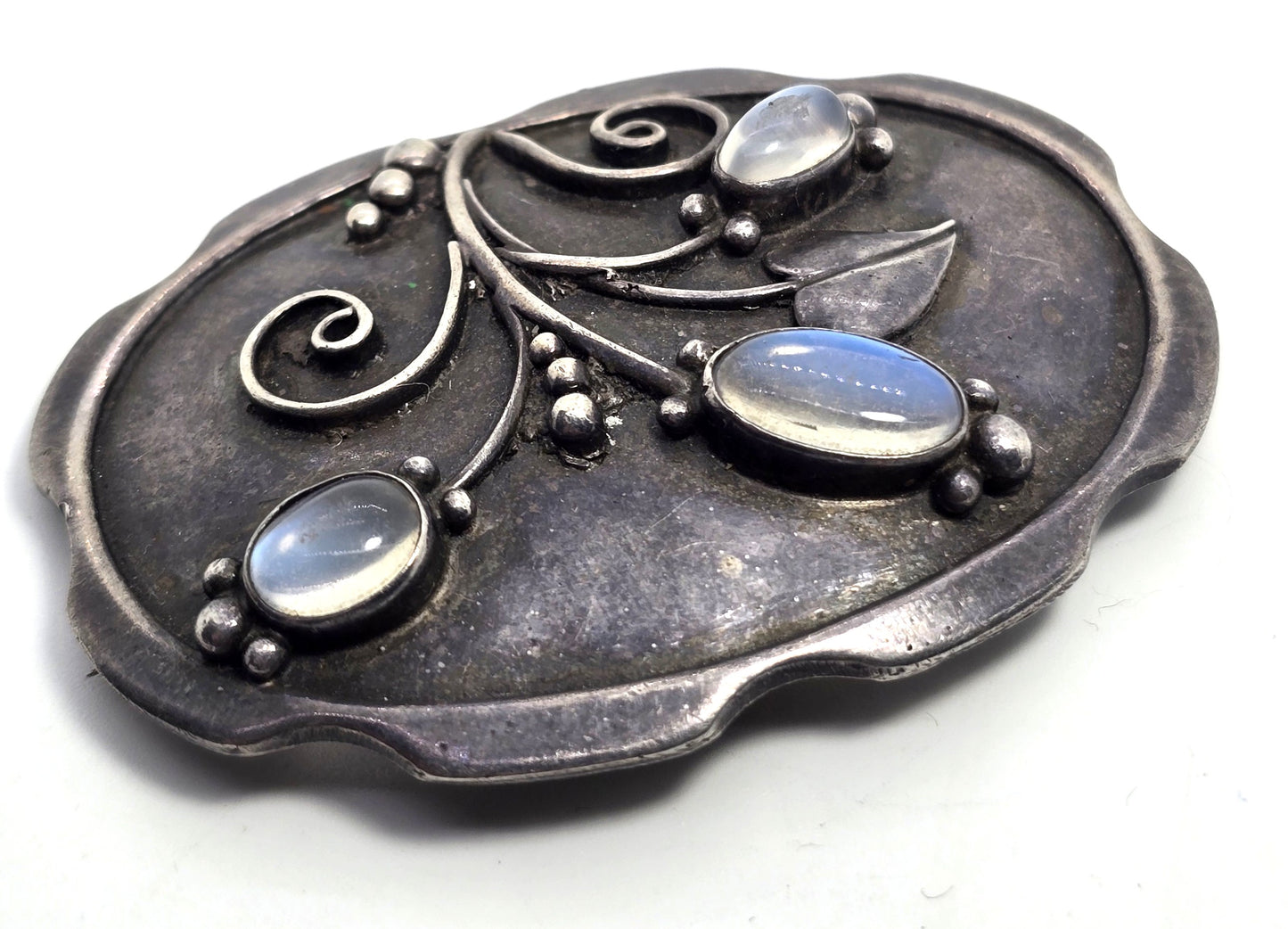 Arts and Crafts blue moonstone flower sterling silver antique brooch