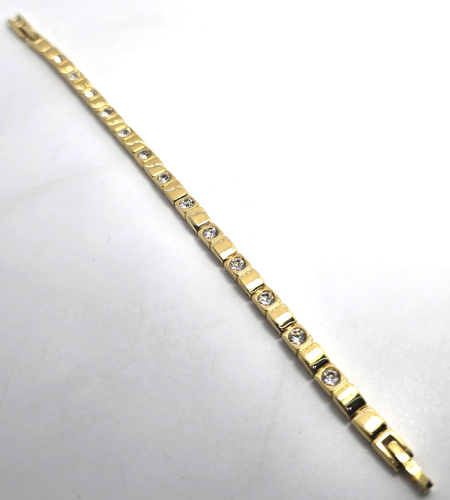 Single row simple clear gold toned vintage rhinestone tennis bracelet