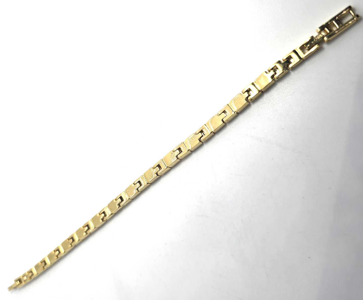 Single row simple clear gold toned vintage rhinestone tennis bracelet